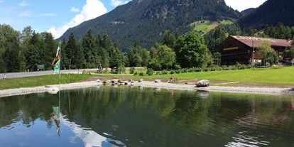 Reisemobilstellplatz - Umgebungsschwerpunkt: Fluss - Österreich - Wunderschöner Bergsee - Camping am See Gut Lindlerhof, mit Ferienhäuser und Almhütten