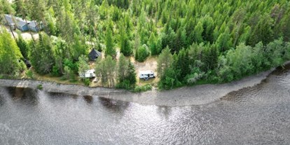 Motorhome parking space - Wintercamping - Jämtland - Stellplätze am Wasser  - Ammeråns Fiskecamp AB