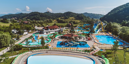 Motorhome parking space - Duschen - Slovenia - View from above on pools in Terme Olimia - Campingplatz Natura – Terme Olimia*****