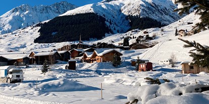 Reisemobilstellplatz - Art des Stellplatz: bei Gewässer - Graubünden - Wintercamping direkt an der Langlauf-Loipe - Camping Viva