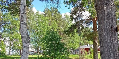 Motorhome parking space - Wintercamping - Northern Sweden - Schaukel mit Blick auf den schönen Hemsjön - Trollforsen Camping & Cottages Services AB