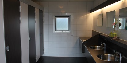 Reisemobilstellplatz - Lathum - luxe sanitair - Kampeerhoeve Bussloo