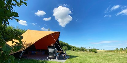 Motorhome parking space - Umgebungsschwerpunkt: See - Antwerpen - onze tent op het trekkersveld - Camping Zeeuws Genieten