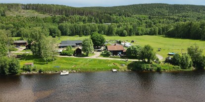 Motorhome parking space - Stromanschluss - Sweden - Nice campsite at the river Klarälven and the foot of the mountains - Sun Dance Ranch