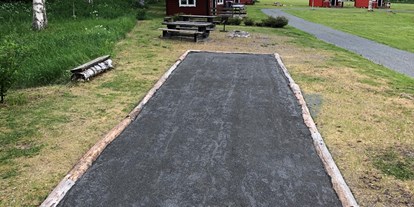Motorhome parking space - Hunde erlaubt: Hunde erlaubt - Sweden - jeu de boule - Hammarstrands Camping, Stugby och Kafé