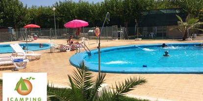 Motorhome parking space - Wintercamping - Spain - Swimmingpools only summer. Swimmingcap needed. - Camping Los Naranjos