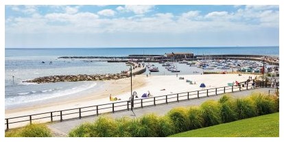 Motorhome parking space - South West England - Photo of the harbour and beach in Lyme Regis - Hook Farm Campsite