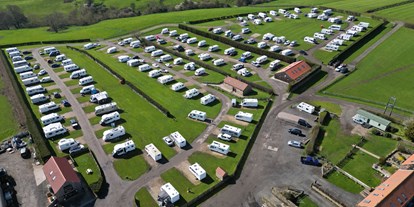 Motorhome parking space - Great Britain - Aerial view of the distance from the road , and the surroundings - Broadings Farm Caravans and Holiday Cottages