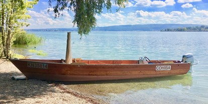 Reisemobilstellplatz - SUP Möglichkeit - Singen - Gerne zeigen wir euch den Bodensee mit unserem traditionellen Holzboot. - Bodenseecamper