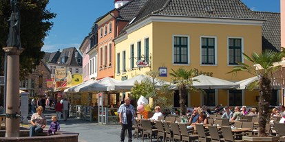 Reisemobilstellplatz - Gepflegter Luftkurort Xanten mit schöner Altstadt und zahlreichen Cafés und Restaurants! - WomoPark-Xanten