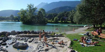 Parkeerplaats voor camper - Bademöglichkeit für Hunde - Oostenrijk - Badesee Weisslahn Wasserspielpaltz 2km entfernt - Stellplatz Plankenhof / Wohnmobilstellplatz Tirol 