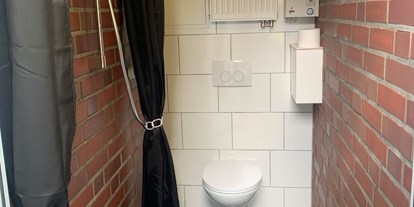 Reisemobilstellplatz - Entsorgung Toilettenkassette - Oldenburger Münsterland - Wohnmobilstellplatz Erlebnishof Reekenfeld 