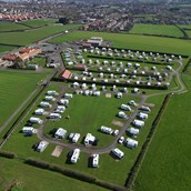 RV parking space - Aerial view of the distance to the town and Abbey, less than a mile to walk.  - Broadings Farm Caravans and Holiday Cottages