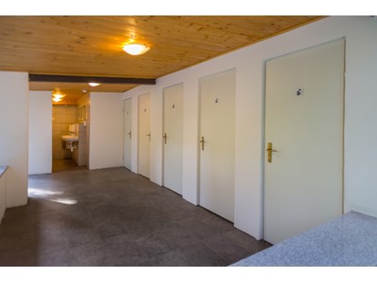 Motorhome parking space - Slovenj Gradec - Part of our toilete and eco shower areas with alway hot water available. - Forest Camping Mozirje