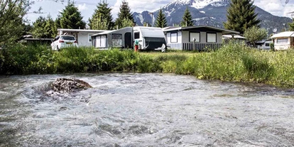 Reisemobilstellplatz - Bademöglichkeit für Hunde - Österreich - Camping Biberhof direkt an einem idyllischen Bach inmitten herrlicher Natur gelegen - Stellplatz am Camping Biberhof