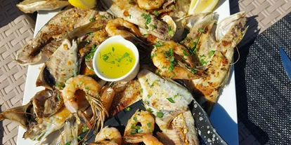 Posto auto camper - SUP Möglichkeit - Adria - Seafood platter - Sunset Camping & Restaurant