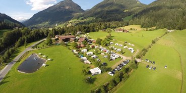 Reisemobilstellplatz - Bademöglichkeit für Hunde - Österreich - Camping am See Gut Lindlerhof, mit Ferienhäuser und Almhütten