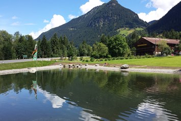 Wohnmobilstellplatz: Wunderschöner Bergsee - Camping am See Gut Lindlerhof, mit Ferienhäuser und Almhütten